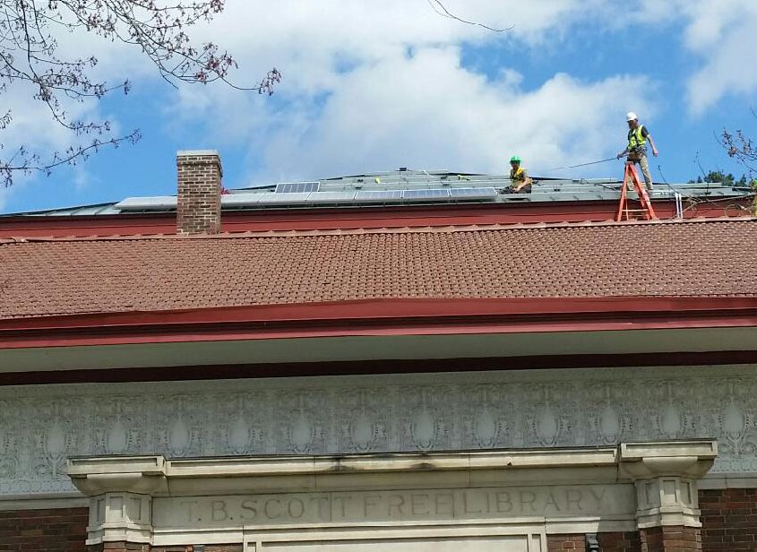 Library roof solar installation in progress