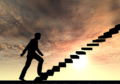 Man climbing stairs with sunrise background