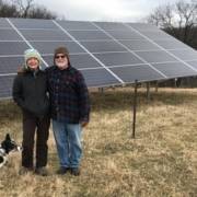 Trisha McConnell and Jim Billings in front of their solar installation