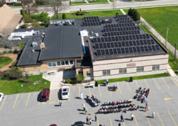 Aerial view of Emmanual Community Methodist Church solar panels and ribbon cutting